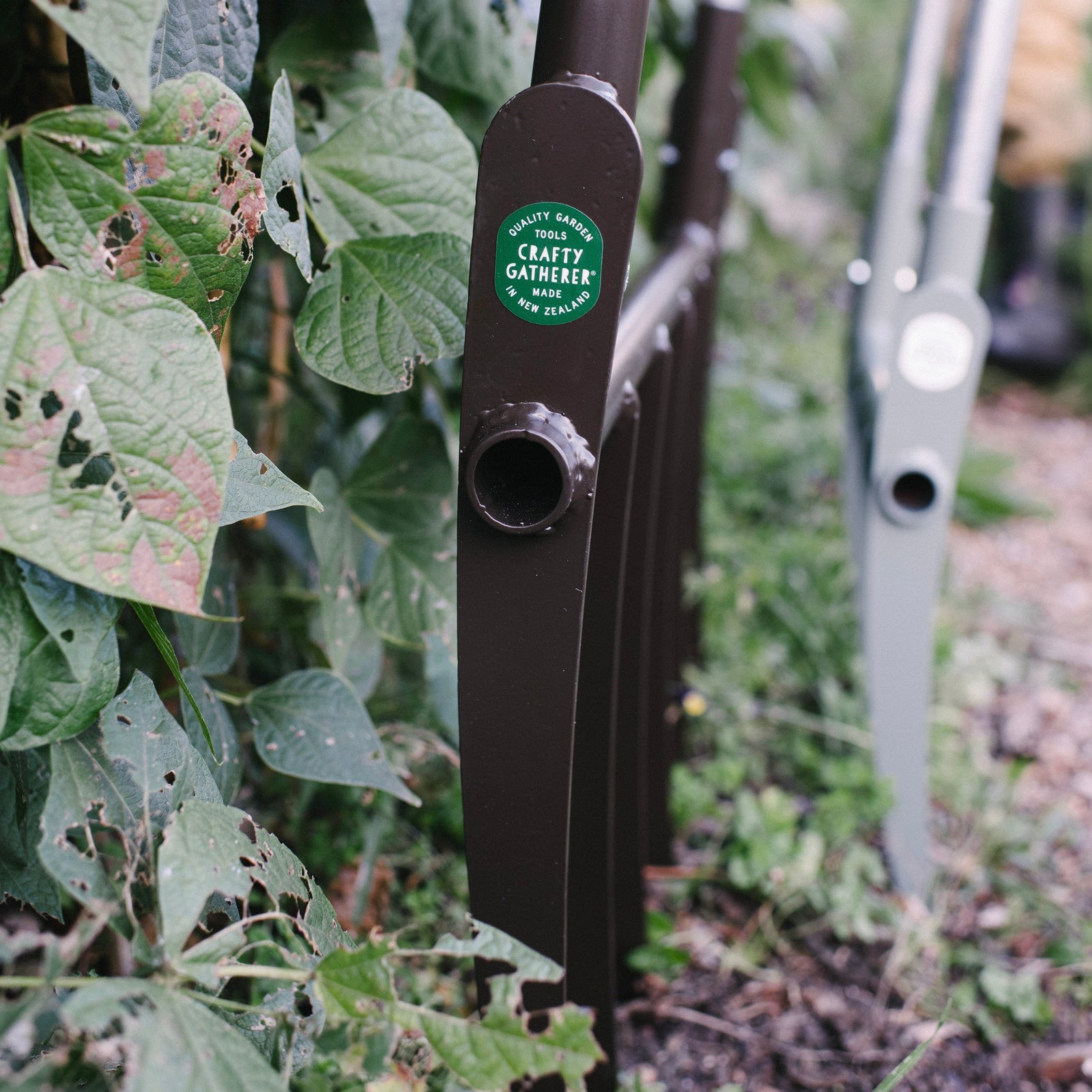 Garden tool with a brand label in a garden setting