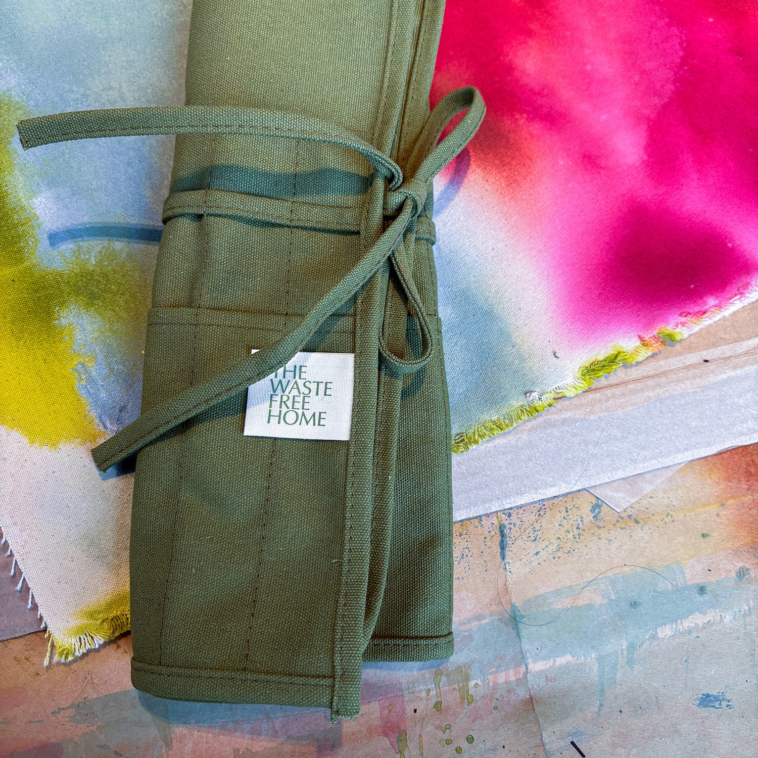 green cotton canvas paint brush holder that can roll up for easy storage or travel