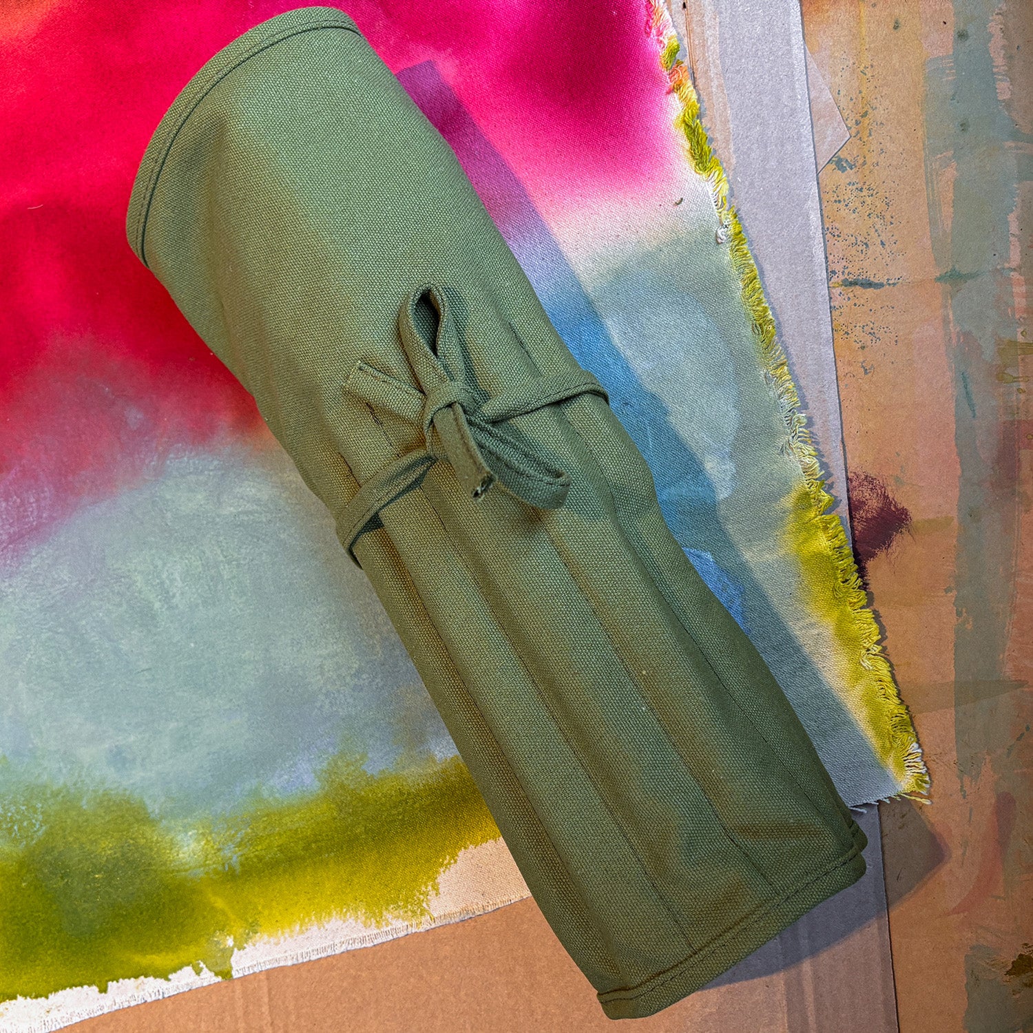 green cotton canvas paint brush holder that can roll up for easy storage or travel