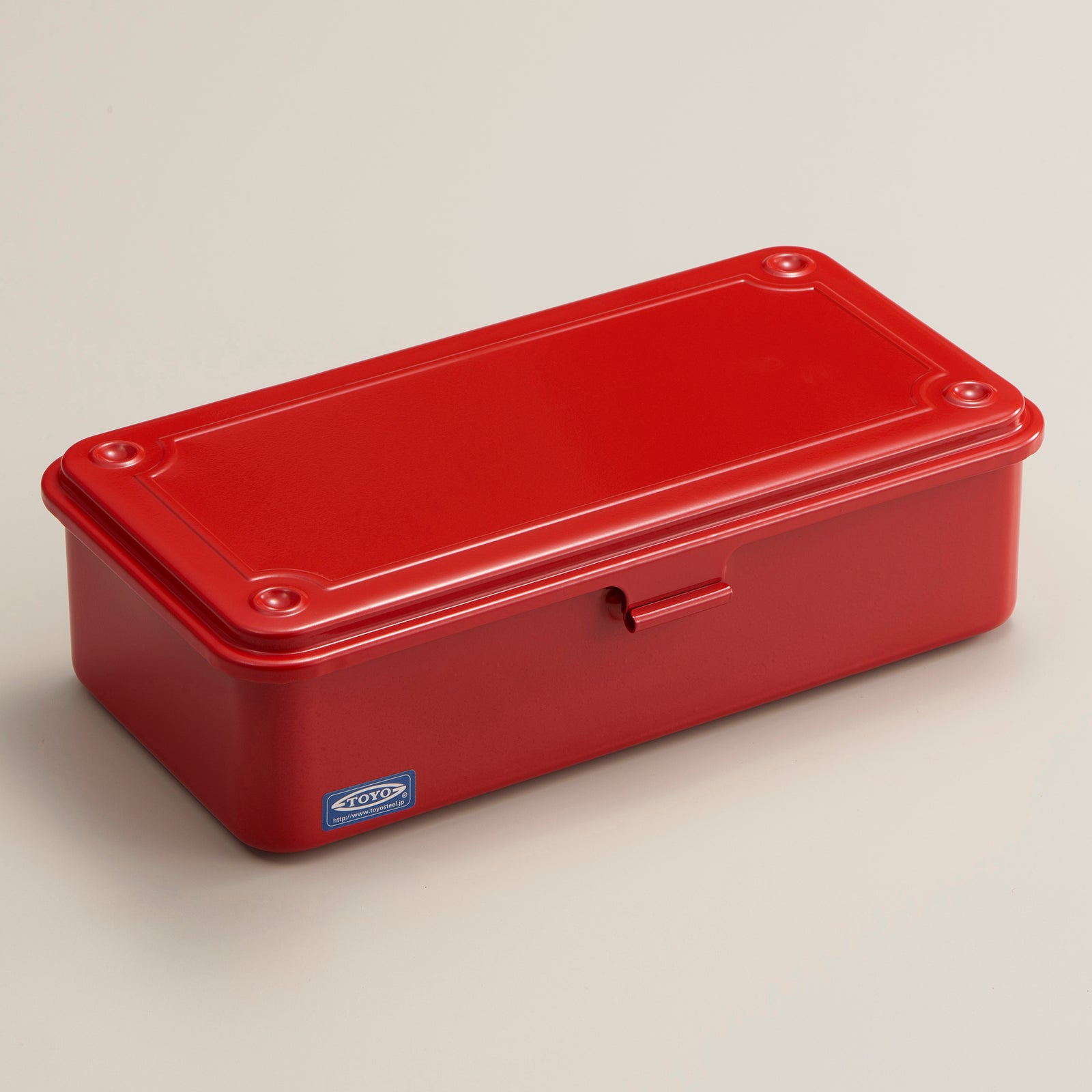 Red metal toolbox made by TOYO from 1 sheet of seamless pressed metal.