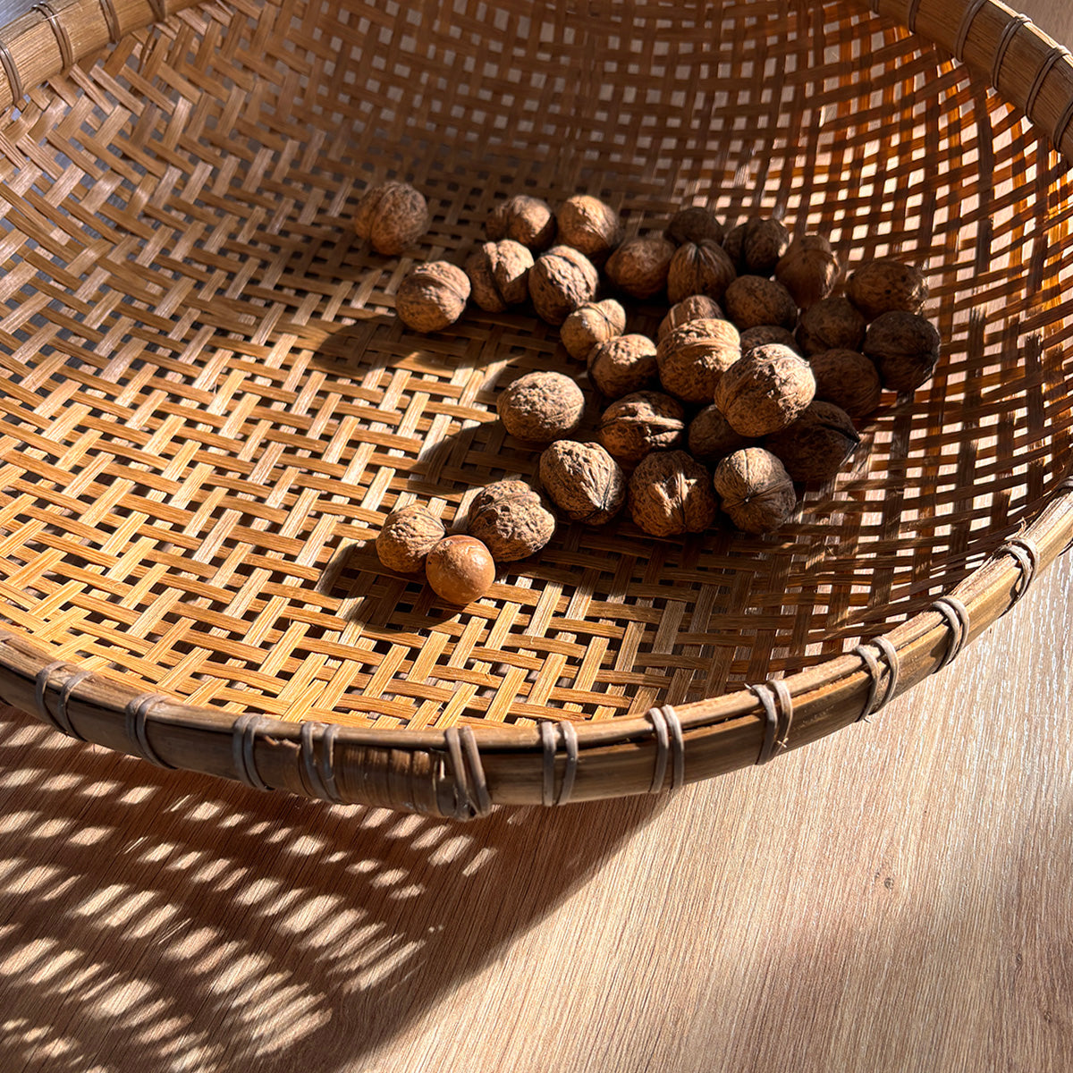woven bamboo low basket, also used for foraging and drying flowers, herbs and nuts