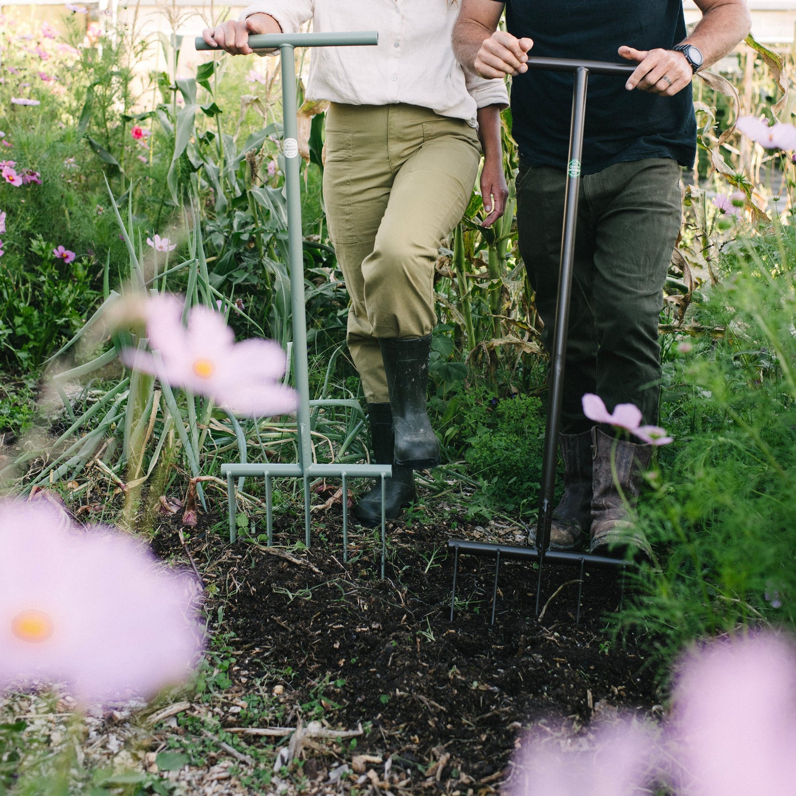 Two people working in a garden with Forksta Gardening Forks.