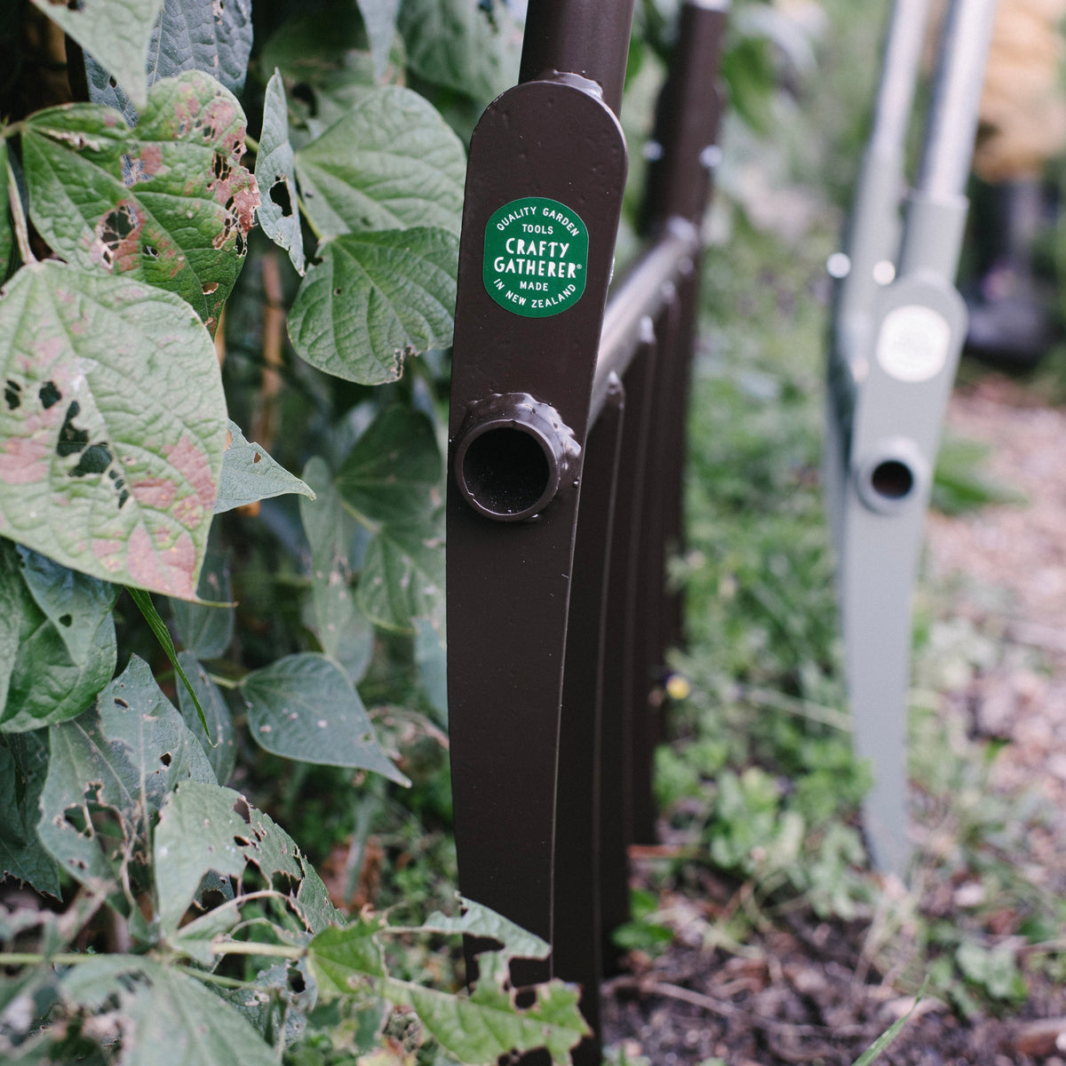 Garden tool with a brand label in a garden setting