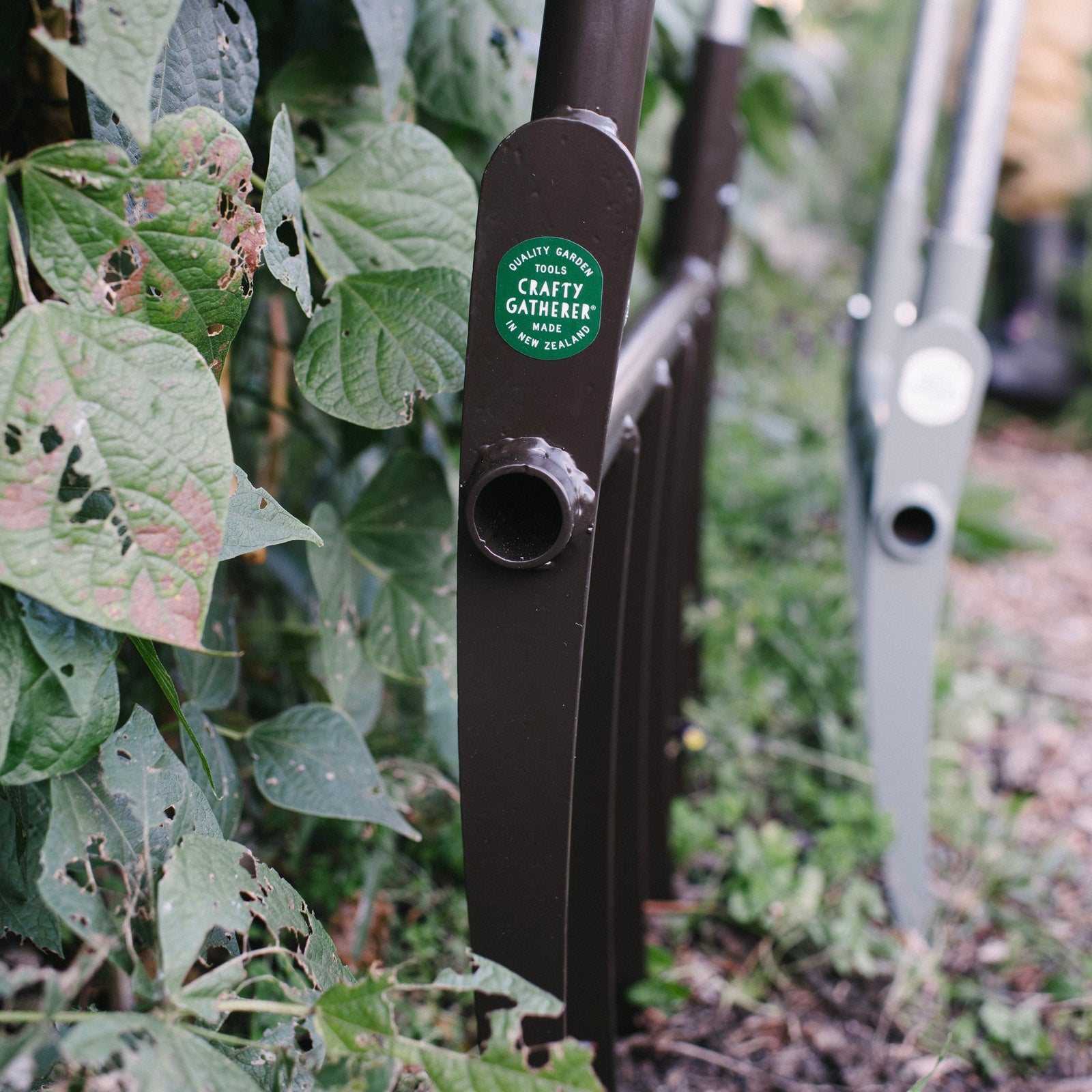 Garden tool with a brand label in a garden setting