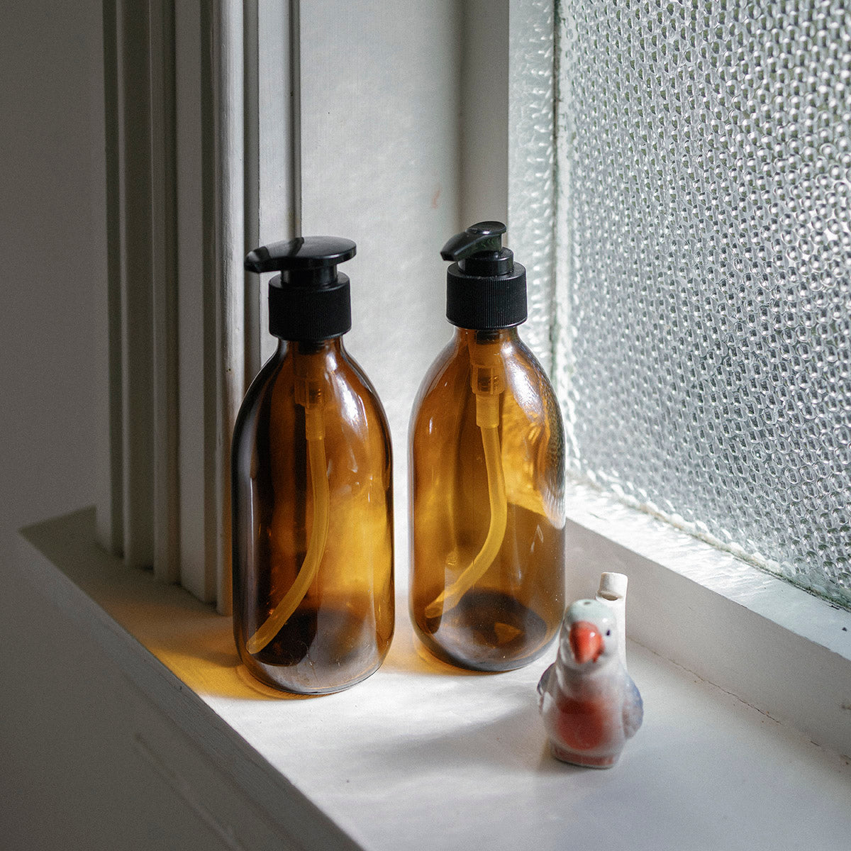 AMBER GLASS PUMP BOTTLES