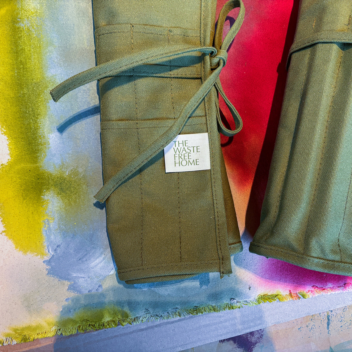 green cotton canvas paint brush holder that can roll up for easy storage or travel