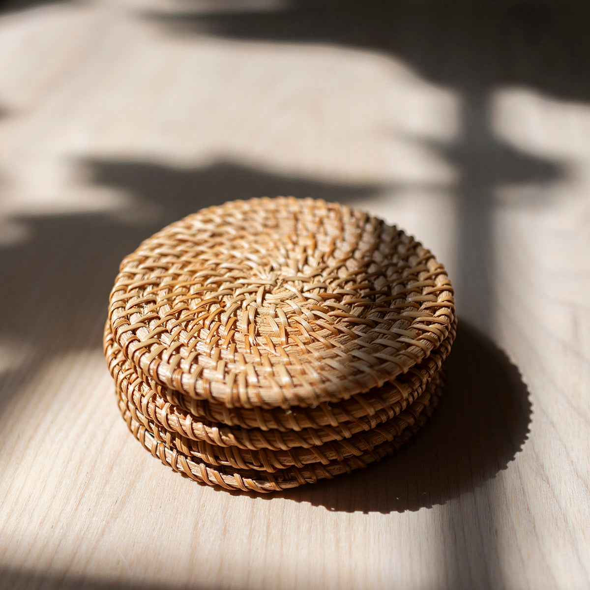 Five round woven coasters 