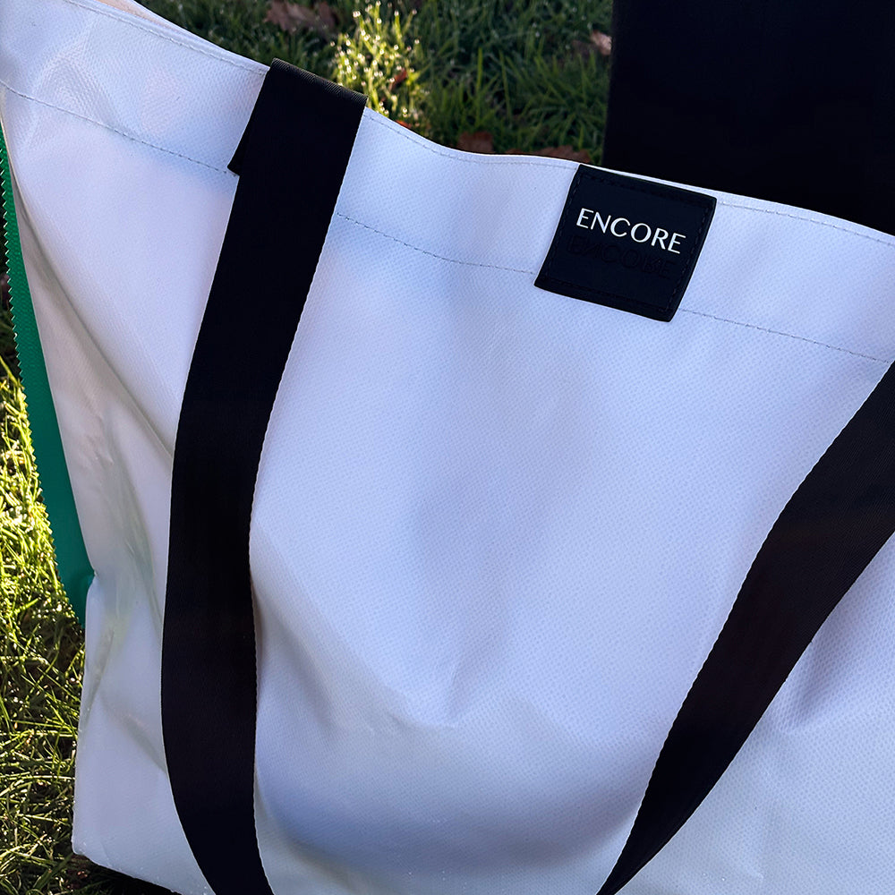 white waterproof bag made from bouncy castle offcuts and expired car seat straps